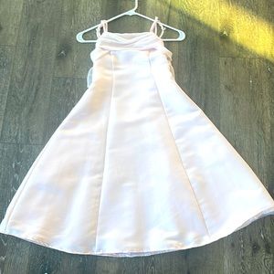 Girls size 8 pink dress with a net fabric bow in the back with classy diamonds.